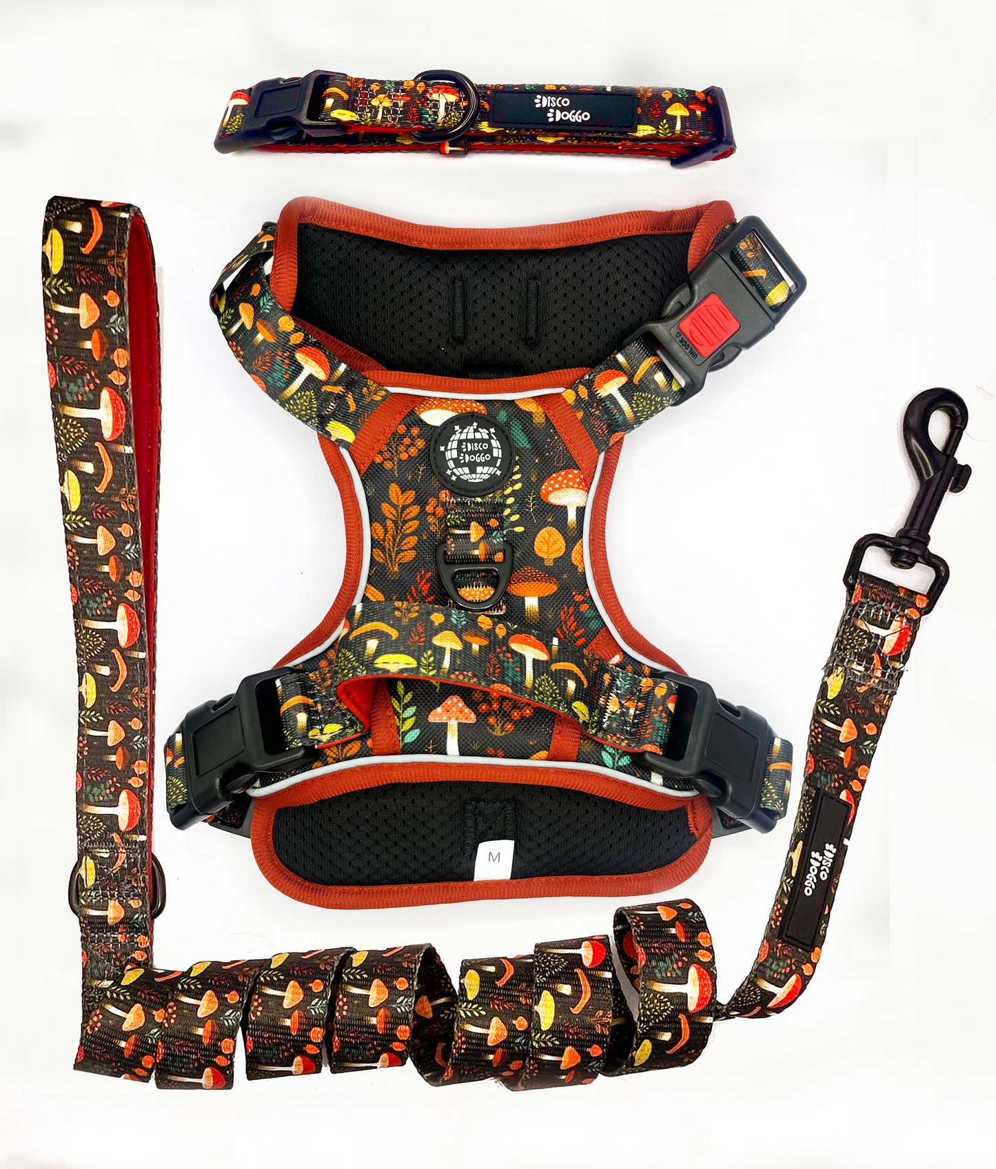 Adjustable technical dog harness featuring an intricate mushroom pattern over a durable fabric. The harness is equipped with heavy-duty buckles for secure fastening, reflective strips for nighttime visibility, and a reinforced handle on the back for better control. The design is complemented with breathable mesh lining for comfort, and multiple attachment points for leashes. The colorful mushroom illustrations add a playful touch to the practical design, suitable for outdoor activities and training sessions